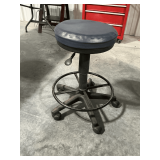 Rolling stool, adjustable height.