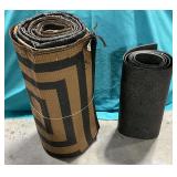 Reversible woven plastic patio mat and smaller vinyl mat