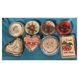 Group of 8 needlepoint and cross stitch glass paperweights