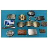 Assortment of belt buckles, money clip, etc.
