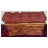 Cedar chest with cushion on top