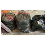 3 large trash bags full of smashed aluminum cans.