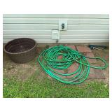 Hose reel basket with garden hose