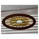 Oval stain glass piece