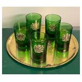 Green glass shot glasses with gold tone under tray