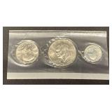 1976 coin set, Eisenhower dollar, Kennedy half dollar and Washington quarter