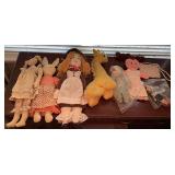 Dolls and stuffed animals, some vintage.
