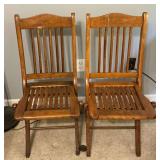 Pair of wooden folding chairs, need tightening.