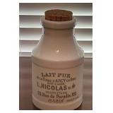 White porcelain milk bottle with French text