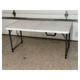 Plastic folding table, adjustable height, 24" x 48".