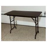 Folding table, 24" x 48", water damage to top edges.