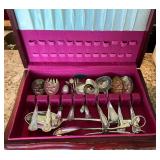 Vintage flatware and serving utensils in wooden box