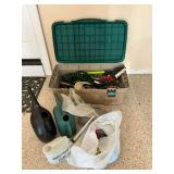 Garden hose, watering cans, garden tools, Rubbermaid tote.