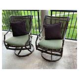 Pair of swivel and rock patio chairs with cushions.