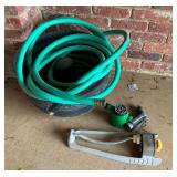 Metal hose basket, garden hose, sprinklers, etc.