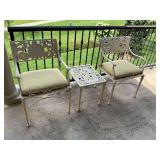Pair of patio chairs and table, cast iron.
