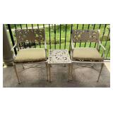 Pair of patio chairs and table, cast iron.