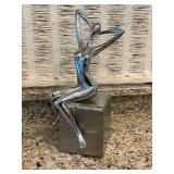 Lady on cube sculpture