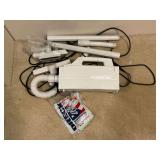 Oreck XL handheld vac with accessories and bags.