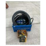 Assortment of garden hose and accessories