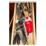 Utensil drawer, serving spoons, can opener, spatulas, scoops, etc.