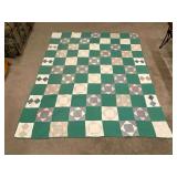 Vintage patchwork quilt, hand quilted, shows wear