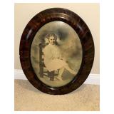 Antique oval frame with curved glass