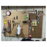 Pegboard contents, screw drivers, clock, pliers, shelf brackets, etc.