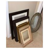 Vintage oval frame with curved glass and other picture frames