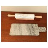 Marble rolling pin on wood stand and marble cutting board.
