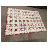 Patchwork quilt, hand quilted, shows some wear and some stains