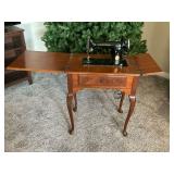 Antique Singer sewing machine SN EE675008 in cabinet
