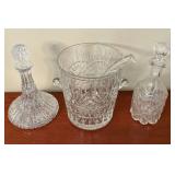 Crystal ice bucket, glass decanters, glass ladle