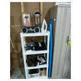 Plastic shelf and contents, Coleman battery powered lantern