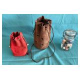 Marbles in leather pouches