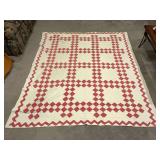 Red and white Irish chain, shows wear and stains, hand quilted