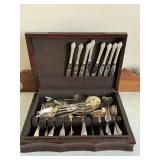 Vintage flatware and serving pieces in wooden box
