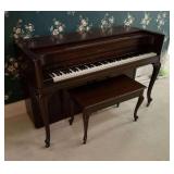 Acrosonic piano with piano seat and sheet music