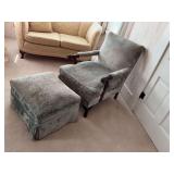 Vintage upholstered armchair with matching ottoman