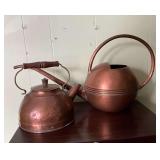 Brass teapot and watering can