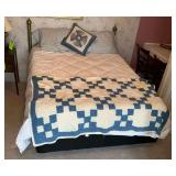 Queen size brass toned headboard with linens, mattress and box springs
