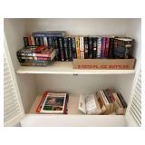 Assortment of books, Navada Barr, Daniel Silva