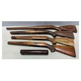 4 wood gun stocks, 1 forearm.