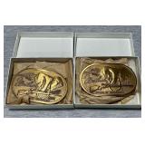 Pair of brass Weatherby belt buckles.
