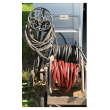 Three Garden Hoses  Two On Roller Caddies