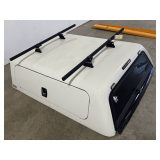 White KAP Truck Cap with Roof Racks and Tinted Windows
