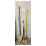 Assorted Long-Handled Hand Tools Including Shovel, Pickaxe, and Edger