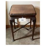 Wooden Accent Table with Carved Details and X-Stretcher Base