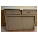 Storage Unit with White Counter Top, Sliding Doors and Drawers