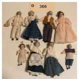 Collection of Eight Bisque Dollhouse Dolls with Fabric Costumes